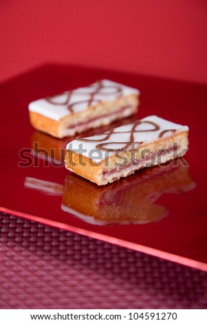 Bakewell Tart slices on red serving plate