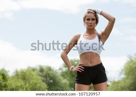 Fitness woman. Beautiful fit woman training to music. Concept sport and fitness