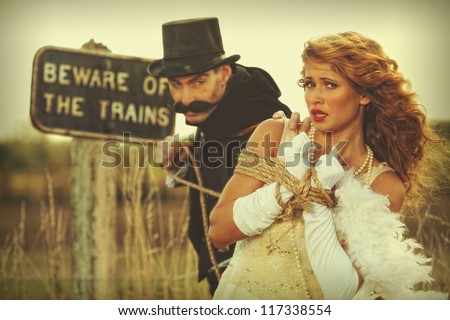 stock-photo-damsel-in-distress-woman-tied-up-by-villain-117338554.jpg