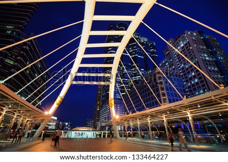 BANGKOK - MAY 3 : Buildings and a sky walk architecture like spider for transit between Sky Transit and Bus Rapid Transit Systems at Sathorn-Narathiwas junction on May 3, 2012 in Bangkok, Thailand.