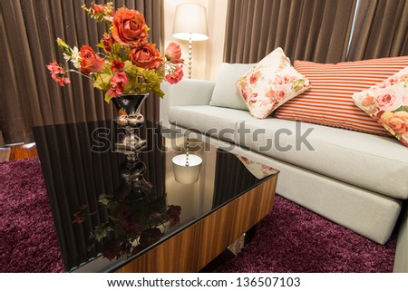 Sofa in living room with decorative flower