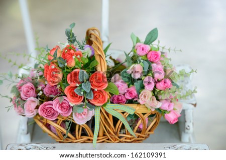 Artificial roses in the basket