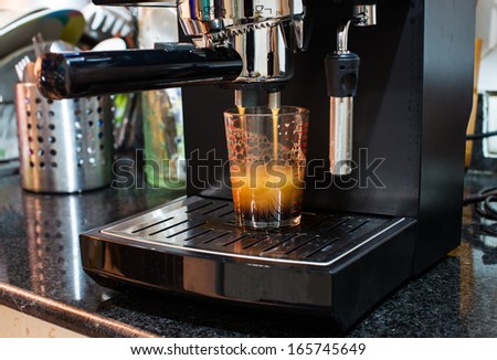 Espresso machine brewing a coffee espresso