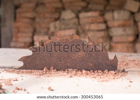close-up picture of a rusty circular saw in an old sawmill
