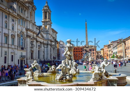 Rome May 9 2015: Fountain of the Four Rivers and the church of Sant\'Agnese in Agone in Piazza Navona.