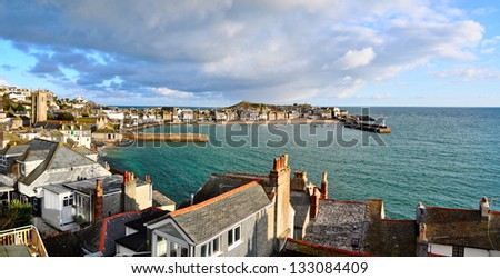 Panorama of St Ives harbour in Cornwall UK with the quaint cottages situated on what is referred to as the Island in the background but which is in fact a peninsula.