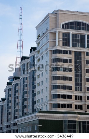 Modern building and communicate mast. Astana, capital of Kazakhstan, march 2007