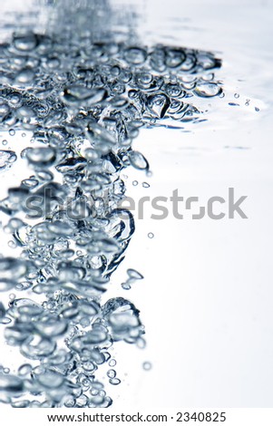 Extreme close up of rise moving up in water
