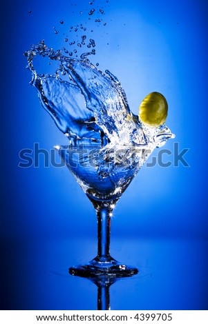 Close up view of the splash martini on blue
