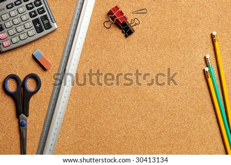Close up view of the office tools on cork board
