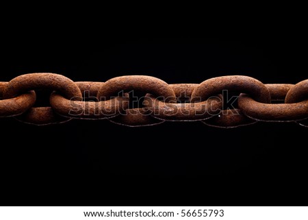 Macro of rusty chain isolated on black background