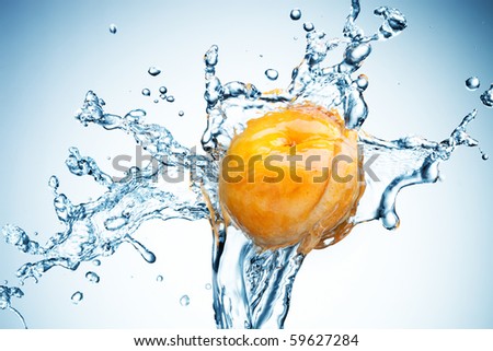 Apricot in spray of water. Juicy peach with splash on white background