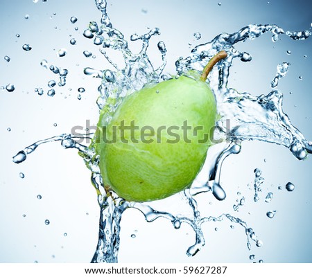 pear in spray of water. Juicy pear with splash on white background