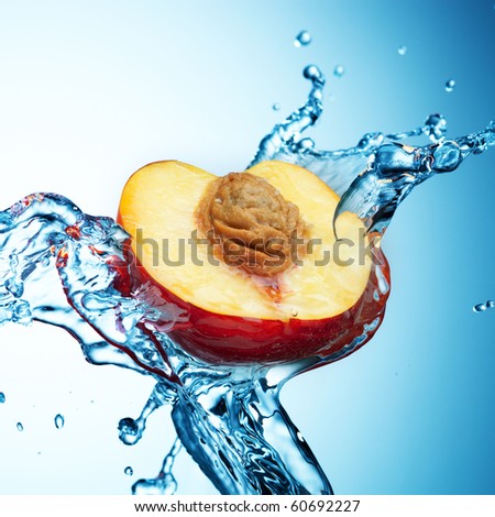 Peach in spray of water. Juicy peach with splash on background