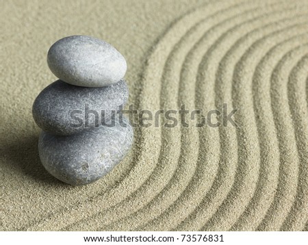 Zen stone in the sand. Background