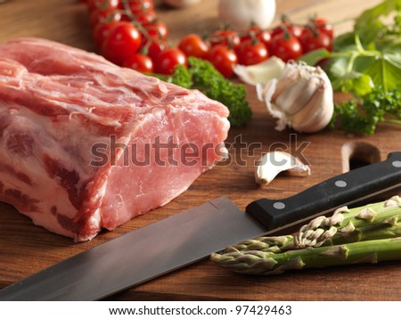 Raw steak on the wooden board.