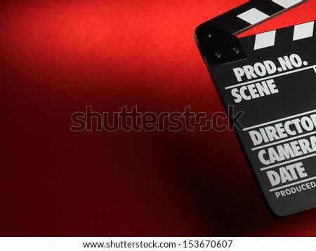 Clapper board on red background Clapper board on red background