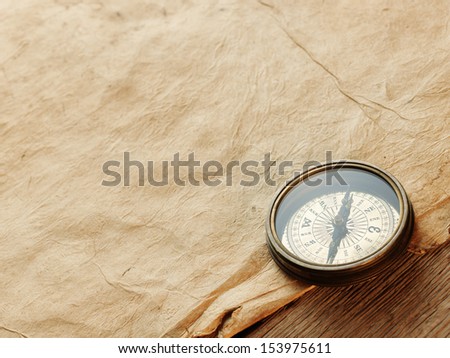 compass on the background of an old paper