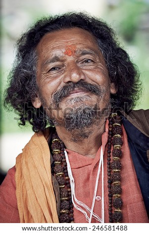 Naggar, INDIA - JULY 17: Â portrait of Brahmin. Smiling Indian Brahmin. Indian man poses for photo. July 17, 2013 in Naggar, Kullu Valley, Himachal Pradesh, India.