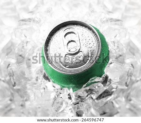 Green soda can in ice