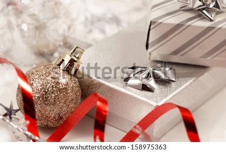 Gift boxes and christmas ball with contrast red detail