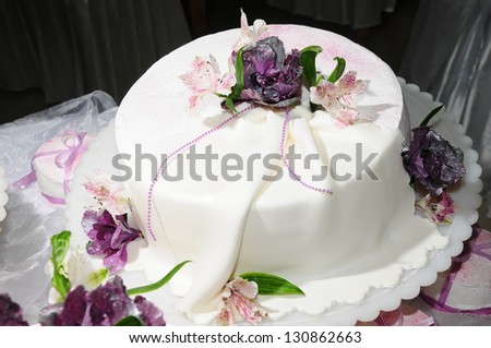 Wedding cake decorated with fresh flowers