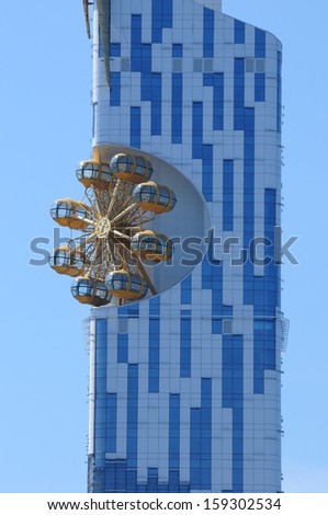 BATUMI, ADJARA, GEORGIA - SEPTEMBER 16: Batumi Technological University Tower on September 16, 2013 in Batumi. It is the first ever skyscraper in the world with an integrated Ferris wheel.