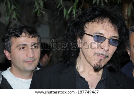 SPITAK, ARMENIA - OCTOBER 1: Tony Iommi of Black Sabbath and one of his fans on October 1, 2009 in Spitak, Armenia. He visits Armenia within the framework of âArmenia Grateful 2 Rockâ project.