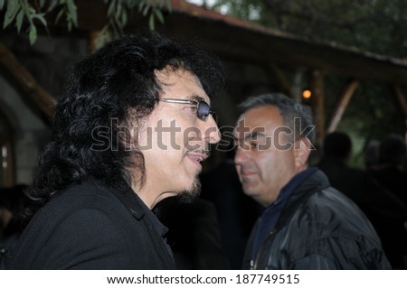 SPITAK, ARMENIA - OCTOBER 1: Tony Iommi of Black Sabbath and one of his fans on October 1, 2009 in Spitak, Armenia. He visits Armenia within the framework of “Armenia Grateful 2 Rock” project.