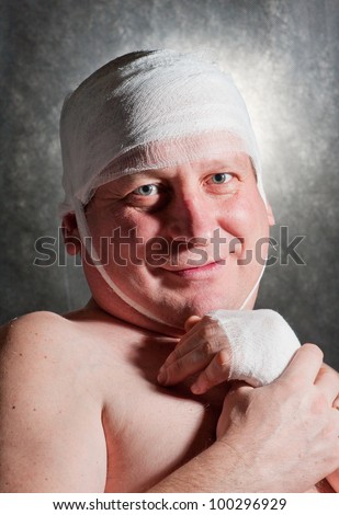 a man bandaged up with a head injury