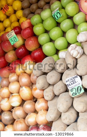 Fruit laid out on sale with price lists