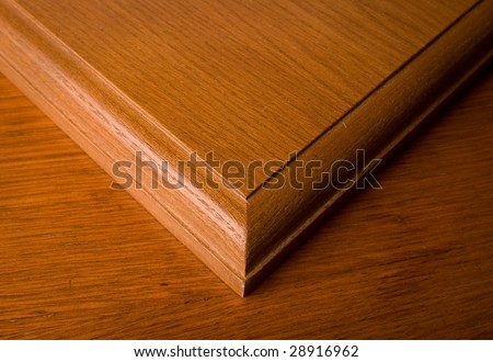 Structures of a tree in the form of the wooden panel with a beautiful edge on one more wooden panel