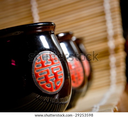 The Japanese cups for tea of black colour with red drawing