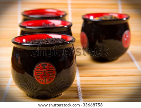The Japanese cups for tea of black colour with red drawing