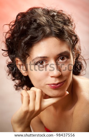 portrait of the young dark-haired girl in studio on color background