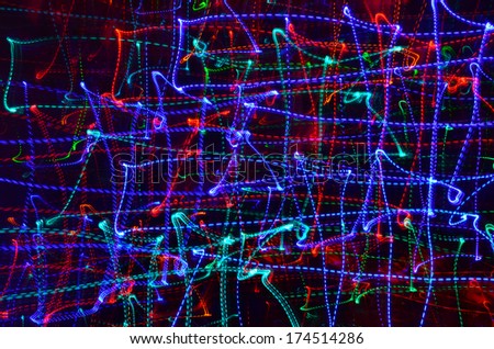 Abstract net of blue, red and purple neon lines on a black background