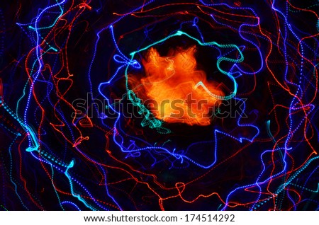 Abstract universe - blue, red and purple neon spirals and an orange nebulosity on a black background