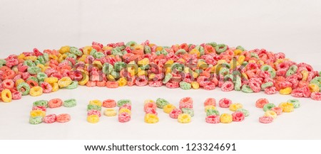 Group of fruit cereal. Candy word written with cereals.