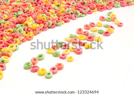 Group of fruit cereal. Candy word written with cereals.