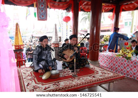 NAMDINH, VIETNAM - APRIL 13: An unidentified group of people sings folk songs in Phu Day festival on April 13, 2013 in Nam Dinh, Vietnam. An annual event in Nam Dinh, Vietnam