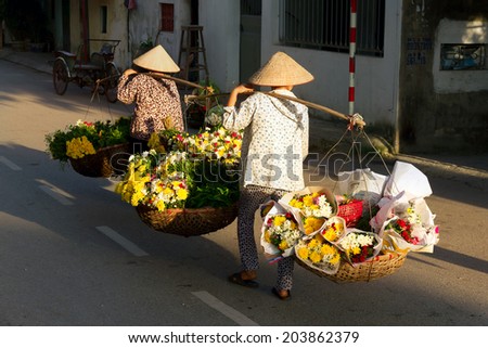 women selling flowers on city in the early morning