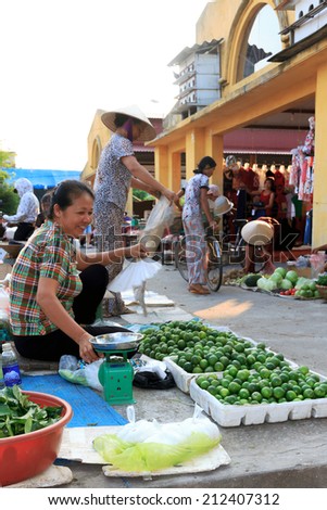 HANOI, VIETNAM July 23, 2014: unidentified woman selling food in small markets in Hanoi, Vietnam.