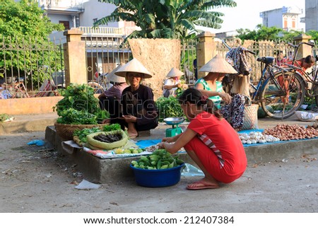 HANOI, VIETNAM July 23, 2014: unidentified woman selling food in small markets in Hanoi, Vietnam.