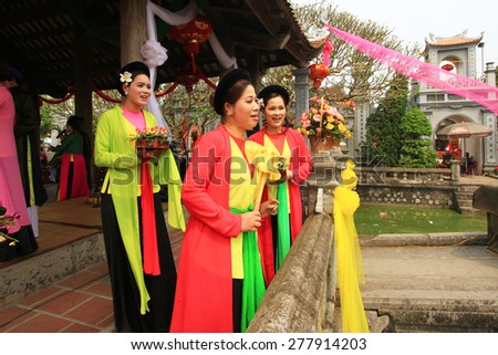NAMDINH, VIETNAM April 13, 2013: An unidentified group of folk songs and dance sings in Phu Day festival in Nam Dinh, Vietnam. This is the traditional art of Vietnam.