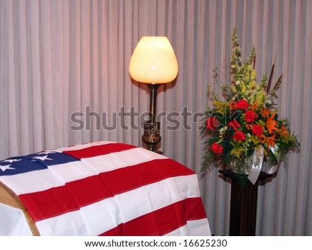american flag draped over a casket of a war veteran