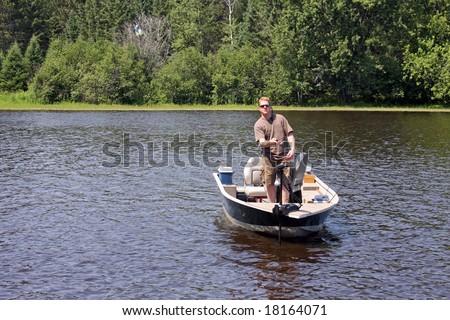 fisherman making a cast from a boat