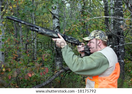 safe hunter wearing an orange vest