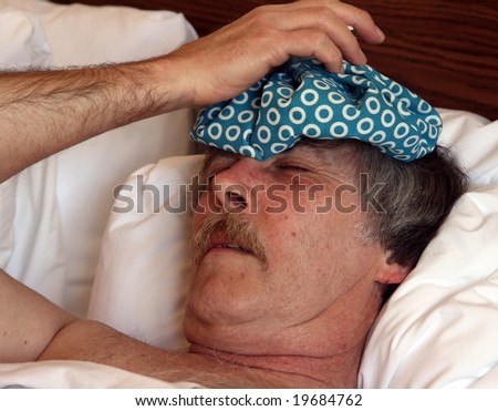 ice bag on a man in bed