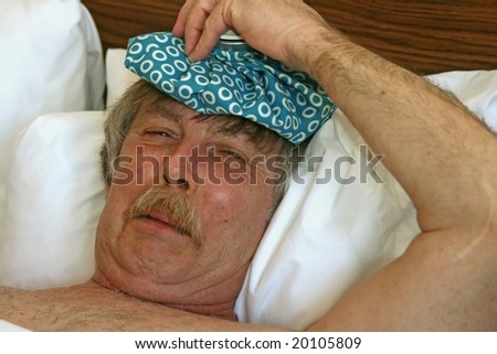 man with an ice-bag in bed