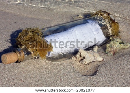 help message in a bottle washed up on an ocean beach